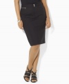 Silver-tone buckle-and-snap closures lend modern edge to Lauren by Ralph Lauren's tailored plus size skirt, crafted from stretch cotton for a figure-flattering fit.