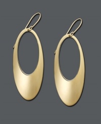 Fluid design in rich gold color. Open-cut hoops feature an oval shape crafted in 14k gold. Approximate drop: 2 inches. Fluid design in rich gold color. Open-cut hoops feature an oval shape crafted in 14k gold. Approximate drop: 2 inches.