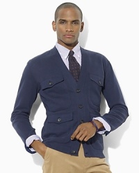 Accented with Italian leather elbow patches for a luxe finishing touch, this handsome V-neck cardigan defines masculine polish in lightweight cotton moleskin. Accented with Italian leather elbow patches for a luxe finishing touch, this handsome V-neck cardigan defines masculine polish in lightweight cotton moleskin.