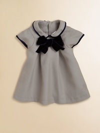 With a chic row of buttons down the back and a striking velvet bow in front, this charming dress is the epitome of French style.Peter Pan collarBack button closureCap sleevesFront and back pleatsKnee lengthFully lined67% polyester/33% viscoseMachine washMade in France Please note: Number of buttons may vary depending on size ordered. With a chic row of buttons down the back and a striking velvet bow in front, this charming dress is the epitome of French style.Peter Pan collarBack button closureCap sleevesFront and back pleatsKnee lengthFully lined67% polyester/33% viscoseMachine washMade in France Please note: Number of buttons may vary depending on size ordered.