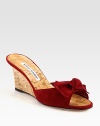 Natural cork wedge with a suede upper and bow adornment. Cork-covered wedge, 2¾ (70mm)Suede and natural cork upperBuffed leather soleMade in ItalyOUR FIT MODEL RECOMMENDS ordering one half size up as this style runs small. 