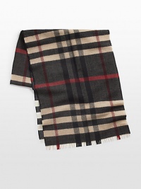 Signature reversible check design with soft frayed edges, shaped in superior wool.Fringed ends16W x 67LWoolDry cleanMade in Italy Signature reversible check design with soft frayed edges, shaped in superior wool.Fringed ends16W x 67LWoolDry cleanMade in Italy