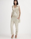 Parka-inspired details dress up this sleeveless zip-front design.Foldover collarAsymmetrical front zipSnap detailsFlap pocketsSide slash pocketsGathered hemlineBack vent with rivet detailsFully linedAbout 32 from shoulder to hem60% viscose/40% polyesterDry cleanImportedModel shown is 5'9 (175cm) wearing US size 4. 