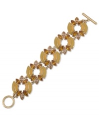 The bold standard. Carolee's flex bracelet is crafted from gold-tone mixed metal with multicolor glass stones adding a vibrant touch. Approximate length: 7-1/2 inches. The bold standard. Carolee's flex bracelet is crafted from gold-tone mixed metal with multicolor glass stones adding a vibrant touch. Approximate length: 7-1/2 inches.