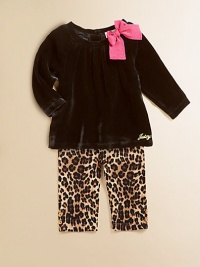 A plush velour tunic is adorned with a standout bow and Juicy signature and paired with cheetah-printed leggings for a wild ensemble.Round neckline with bowLong sleevesBack buttonsGathered bodicelLogo on hemElastic waistbandAnkle button detailCotton/SpandexMachine washImported Please note: Number of buttons may vary depending on size ordered. A plush velour tunic is adorned with a standout bow and Juicy signature and paired with cheetah-printed leggings for a wild ensemble.Round neckline with bowLong sleevesBack buttonsGathered bodicelLogo on hemElastic waistbandAnkle button detailCotton/SpandexMachine washImported Please note: Number of buttons may vary depending on size ordered.