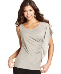A thoughtfully designed top that changes the look of casual style, this piece from Jessica Simpson features a dramatic sleeve and subtle, metallic sheen. A thoughtfully designed top that changes the look of casual style, this piece from Jessica Simpson features a dramatic sleeve and subtle, metallic sheen.