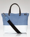 This durable, downtown tote is perfect for everyday use with its modern color block design and reinforced material.