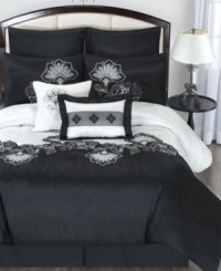 A dramatic black and white palette gives this Esme comforter set a chic and sophisticated look. Embellished with a modern floral pattern, striped accents and a lustrous sheen, this set makes a full impact in the bedroom. A dramatic black and white palette gives this Esme comforter set a chic and sophisticated look. Embellished with a modern floral pattern, striped accents and a lustrous sheen, this set makes a full impact in the bedroom.