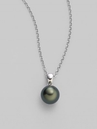 From the South Sea Collection. Elegantly simple with a black, round cultured South Sea pearl hanging from a chain of 18k white gold. 9mm black round cultured pearl Quality: A+ 18k white gold Length, about 18 Spring ring clasp Imported