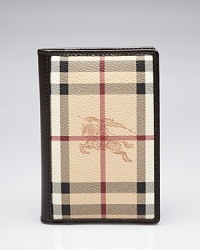A signature print lends well-traveled flair to this Burberry passport case, which opens to credit card pockets. A signature print lends well-traveled flair to this Burberry passport case, which opens to credit card pockets.