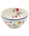 Freshen up. Colorful wildflowers scatter inside and out on the Scallop Floral cereal bowl, a charming addition to country settings from Marcela for Prima Design. With dainty blue trim.