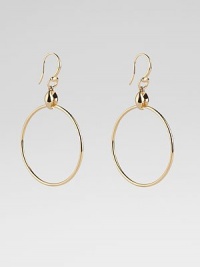 From the Marina Collection. A polished, tubular hoop suspends from a distinctively sculpted link. 18k yellow gold Diameter, about 1½ Ear wire Made in Italy