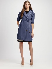 This lightweight design features button details at the sleeves.Gathered drawstring necklineLeather-tipped self sash beltSide slash pocketsButton details on sleevesContrast liningWaterproofReversibleAbout 35 from shoulder to hemMachine wash64% polyester/36% nylonFill: goose downImportedModel shown is 5'10 (177cm) wearing US size 4. This lightweight design features button details at the sleeves.Gathered drawstring necklineLeather-tipped self sash beltSide slash pocketsButton details on sleevesContrast liningWaterproofReversibleAbout 35 from shoulder to hemMachine wash64% polyester/36% nylonFill: goose downImportedModel shown is 5'10 (177cm) wearing US size 4.