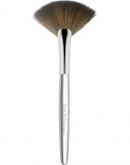 The latest addition to Trish's iconic collection of handcrafted makeup artistry brushes, the flat, arched shape and fine edge of Brush 62 Fan is precision-cut to deposit a whisper of color along the features, a veil of finishing powder to the under-eye, or as a tool to gently fan away fallout for a perfect finish. 