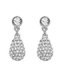 Make a statement worthy of the red carpet. Swarovski's sparkling teardrop earrings are embellished in clear crystal pavé and dangle from an elegant pair of silver tone mixed metal earrings. Approximate drop: 3/4 inch. Make a statement worthy of the red carpet. Swarovski's sparkling teardrop earrings are embellished in clear crystal pavé and dangle from an elegant pair of silver tone mixed metal earrings. Approximate drop: 3/4 inch.