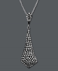 It's a black tie affair. Glam it up in Kaleidoscope's tie-shaped smokey crystal pendant. Crafted in sterling silver with Swarovski elements. Approximate length: 18 inches. Approximate drop: 1-5/8 inches. It's a black tie affair. Glam it up in Kaleidoscope's tie-shaped smokey crystal pendant. Crafted in sterling silver with Swarovski elements. Approximate length: 18 inches. Approximate drop: 1-5/8 inches.