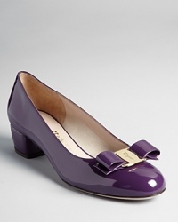A logo-etched buckle tops these sleekly-styled low-heeled pumps. A logo-etched buckle tops these sleekly-styled low-heeled pumps.