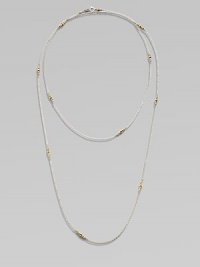 A long-enough-to-double sterling silver chain, delicately spaced with clusters of tiny, faceted 14k gold beads.14k yellow gold and sterling silverLength, about 40Spring ring claspMade in USA