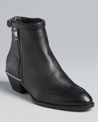 The height of luxe, the Chloé Beatle booties are the ultimate in little black booties. Stitchless quilting feels of-the-moment, while hints of metal hardware lend a shining finish. The height of luxe, the Chloé Beatle booties are the ultimate in little black booties. Stitchless quilting feels of-the-moment, while hints of metal hardware lend a shining finish.