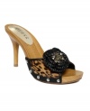 A retro throwback with a fierce twist. Slip on the Malva sandals by GUESS and get to hot stepping with their leopard-print pony hair and bejeweled knit flower accent.