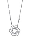 From the Cignature collection, a white gold and diamond pendant on a chain. Designed by Charriol.