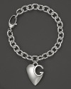 Gucci's signature sterling silver charm bracelet with logo heart charm.