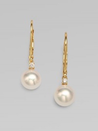 A lustrous piece with Akoya pearls accented with brilliant diamonds set in 18k gold. 7mm white, round, Akoya pearlsDiamonds, .06 tcw18k goldDrop, 1Lever backImported 