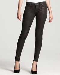 A shimmery python print lends an exotic touch to these J Brand skinny jeans. A shimmery python print lends an exotic touch to these J Brand skinny jeans.