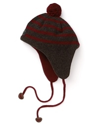 Paul Smith offers up this earthy striped hat, accented with a pom pom on top, contrast earflaps and braided ties at the chin.