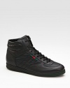 High-top lace-up sneaker with signature green/red/green web detail. Rubber sole Made in Italy 
