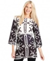 Fill your wardrobe with charismatic contrast: This tunic top from Sunny Leigh does the trick with a bold black-and-white print.