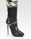 A piercing heel lifts this leather and snakeskin boot with edgy zipper trim, metal studs and a patent leather platform. Lacquered heel, 5¼ (130mm)Shaft, 10Leg circumference, 13½Leather and snakeskin upper with zipper trimPull-on styleLeather liningRubber solePadded insoleMade in Italy
