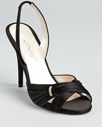 The most subtle of adornments rests atop shimmering satin on these Caparros evening sandals, the finishing touch to a glamourous fête. The most subtle of adornments rests atop shimmering satin on these Caparros evening sandals, the finishing touch to a glamourous fête.