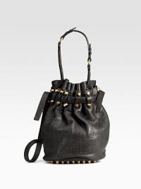 Bold studs and rugged pebble leather join forces in a drawstring bucket bag with lots of attitude. Adjustable leather shoulder strap, 17-21 dropDrawstring closureOne outside open pocketProtective metal feetOne inside zip pocketFully linedLeather14½W X 12H X 8DImported