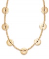 Elaborately embellished. A chic combination of hammered disks and rondelle beading adorn this eye-catching cord necklace from Lauren by Ralph Lauren. Crafted in gold tone mixed metal. Approximate length: 36 inches.
