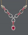 Turn heads with dazzling color and spectacular design. Necklace features oval and round-cut rubies (2 ct. t.w.) and interlocking links decorated in sparkling diamonds (1/2 ct. t.w.). Toggle style necklace crafted in 14k gold. Approximate length: 18 inches. Approximate drop: 2-1/2 inches.