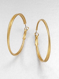 A simply chic piece with two textured rings, intertwined together in a radiant goldtone finish. GoldtoneLength, about 1.8Hinged post backImported A simply chic piece with two textured rings, intertwined together in a radiant goldtone finish. GoldtoneLength, about 1.8Hinged post backImported