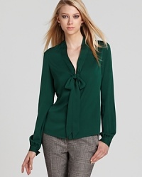 Exude elegance with this Rachel Zoe top finished with a soft bow. Exude elegance with this Rachel Zoe top finished with a soft bow.