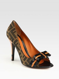 Two-tone bow adorns this peep toe silhouette of logo-printed canvas, elevated by a stacked heel. Stacked heel, 4 (100mm)Canvas jacquard and leather upperPeep toeLeather lining and solePadded insoleMade in ItalyOUR FIT MODEL RECOMMENDS ordering true size. Two-tone bow adorns this peep toe silhouette of logo-printed canvas, elevated by a stacked heel. Stacked heel, 4 (100mm)Canvas jacquard and leather upperPeep toeLeather lining and solePadded insoleMade in ItalyOUR FIT MODEL RECOMMENDS ordering true size.