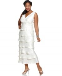 Brilliant for bridal and other elevated occasions, R&M Richards' plus size dress is sparkling perfection with its beaded empire waist and long, tiered silhouette. (Clearance)
