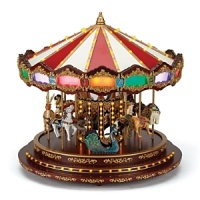 An intricately detailed collector's item, this carousel delights with multicolored illuminated façade panels, a musical light show with over 100 mini LEDs, intricately handpainted figures and beautiful decorative scrollwork. Plays 20 Christmas carols and 20 year-round classics in three different settings.