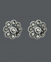 Sweeten your style just in time for warm weather seasons. Flower-shaped Genevieve & Grace stud earrings shine with the addition of round-cut marcasite accents. Crafted in sterling silver. Approximate diameter: 1/4 inch.