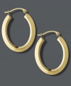 Frame your face with the perfect accent piece. Traditional hoop earrings receive a modern update with a chic, oval shape in polished 18k gold. Approximate drop length: 1 inch. Approximate drop width: 3/4 inch.