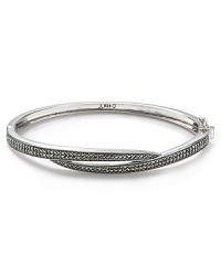 Judith Jack proves simple style can have an edge with this sterling silver bangle. Dipped in marcasite stones, it's crossover design adds seductive sparkle.