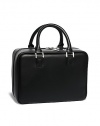 Inspired by Bobbi's Caviar & Oyster Collection, this limited edition case feels polished yet edgy in faux leather with slipper-pink satin lining. Its silver zipper opens wide to reveal mesh compartments and a pocket on the side. A center pouch divider keeps full-size brushes neatly in a row while a travel-friendly handle makes it easy to grab and go. Made in USA. 