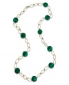 Easy on the eyes. A few precious malachite gems (12 mm) are scattered across an open 14k gold chain necklace, providing any outfit with a vibrant pop of green. Approximate length: 28 inches.