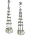 Show off your bold side. These drop earrings feature a stylish silhouette with cultured freshwater pearls (6-6-1/2 mm) adding an elegant touch. Crafted from sterling silver with a rhodium finish. Approximate drop length: 2-1/5 inches. Approximate drop width: 1/2 inch.