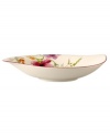 Prolong spring with this shallow Mariefleur serving bowl. Splashy colors adorn premium white porcelain edged in red and crafted in a whimsical leaf shape. Mix and match with New Cottage dinnerware, also by Villeroy & Boch.