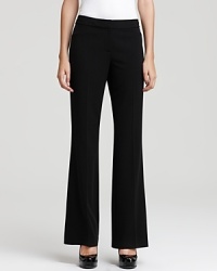 A straight leg with sharp creasing creates a timeless silhouette on these T Tahari pants. A straight leg with sharp creasing creates a timeless silhouette on these T Tahari pants.