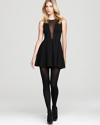A sheer winner for fall, this flirty and feminine For Love & Lemons dress turns this LBD upside down with chic mesh panels in front and back for dramatic first and last impressions. A sheer winner for fall, this flirty and feminine For Love & Lemons dress turns this LBD upside down with chic mesh panels in front and back for dramatic first and last impressions.